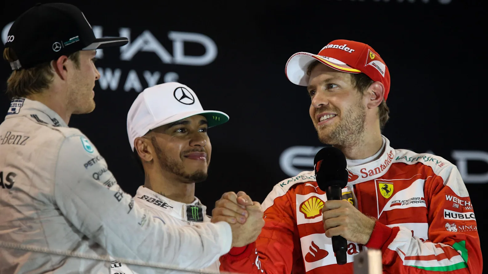 World Champion Nico Rosberg (GER) Mercedes AMG F1 celebrates on the podium with Sebastian Vettel (GER) Ferrari and Lewis Hamilton (GBR) Mercedes AMG F1 at Formula One World Championship, Rd21, Abu Dhabi Grand Prix, Race, Yas Marina Circuit, Abu Dhabi, UAE, Sunday 27 November 2016. &copy; Sutton Images